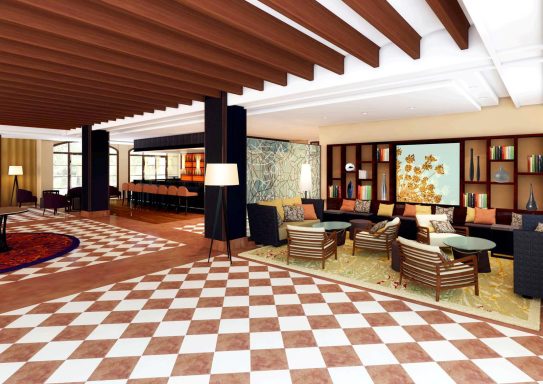 Moderne Lobby mit gemütlichen Sitzbereichen und stilvollem Dekor in warmen Farbtönen.